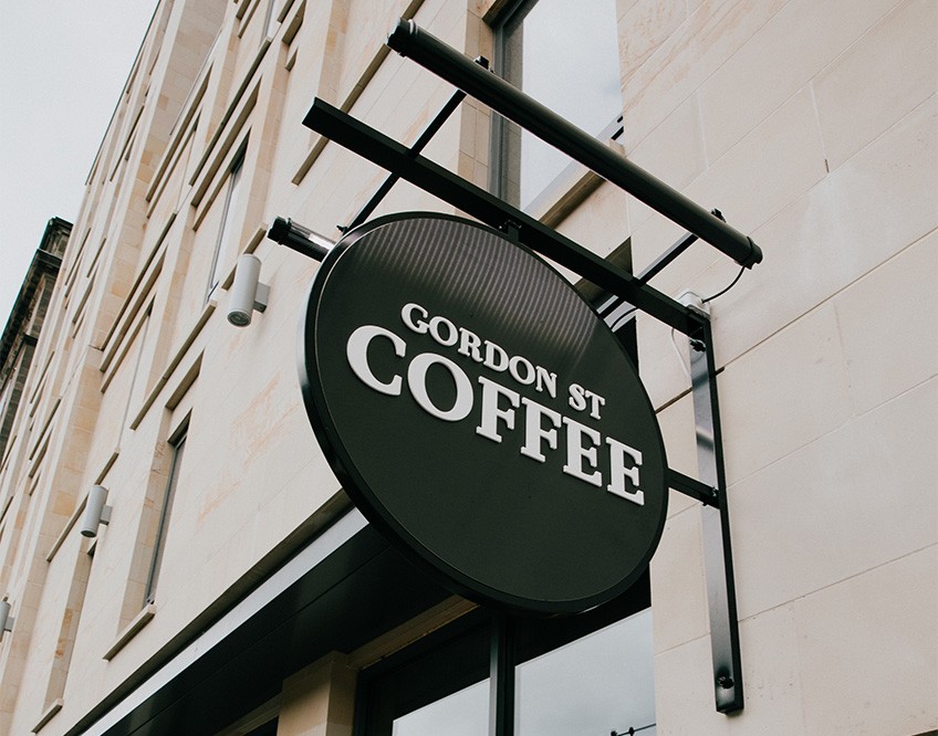 Image of the Gordon St Coffee - Edinburgh sign outside the coffee house venue