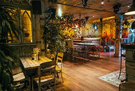 Image of the inside of The Tipsy Bird bar seating area and bar