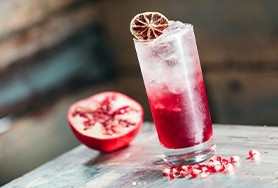 Image of the inside of The Tipsy Bird bar showing an Ann St Cooler drink on a table 